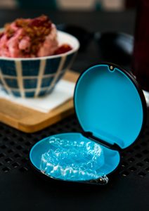 Clear Invisalign aligners designed for busy adults' lifestyles.