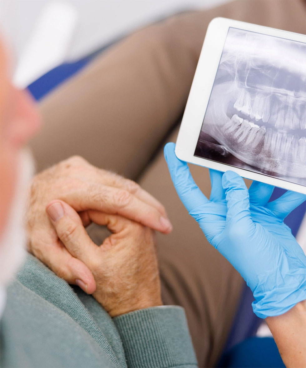 Vancouver dentist explaining CDCP benefits to young family
